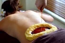 Kati Basti Ayurvedic warm oil therapy — dough ring filled with warm herbal oil applied to lower back
