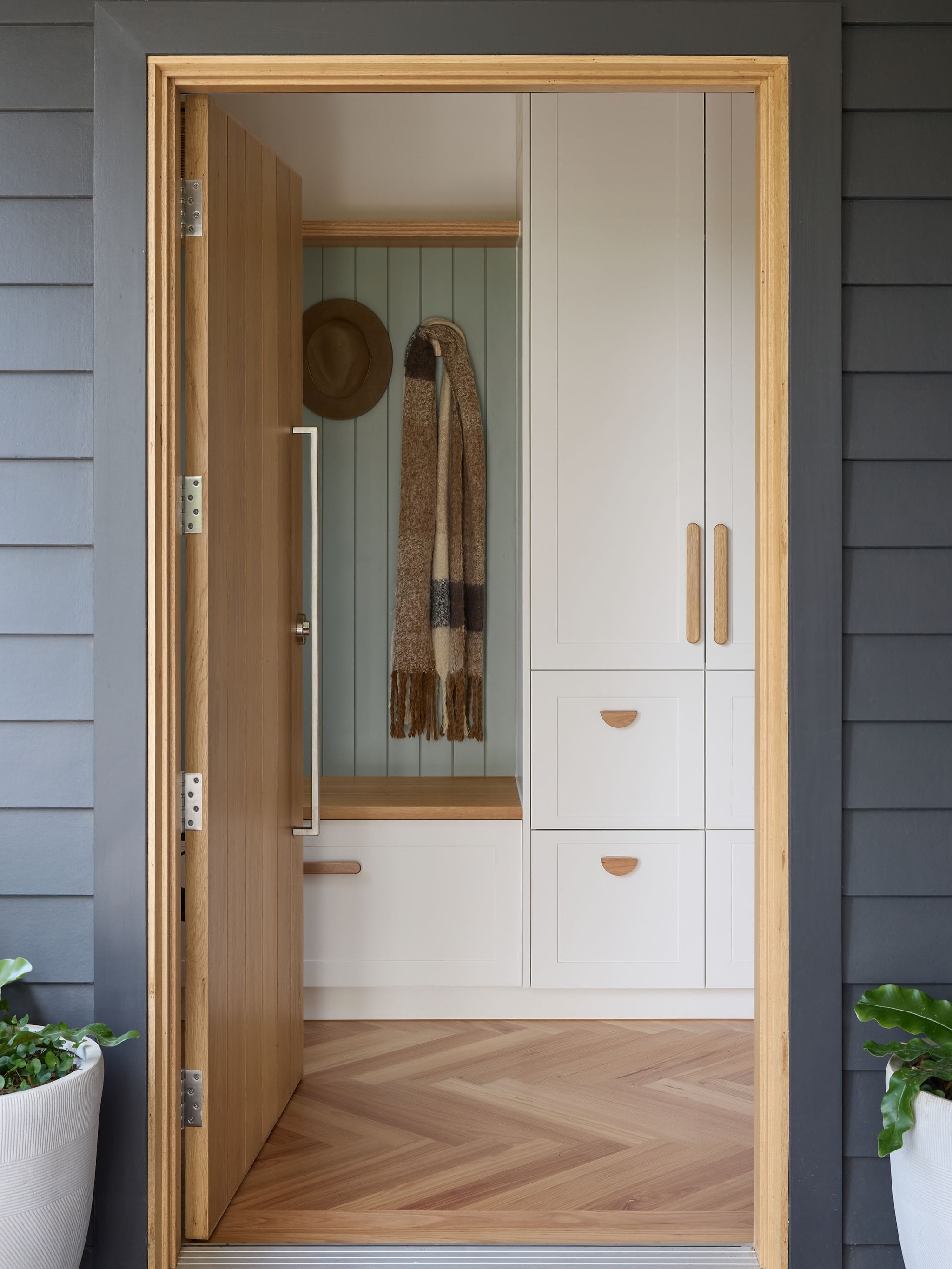 Entryway built-in cabinetry with bench seat and storage drawers