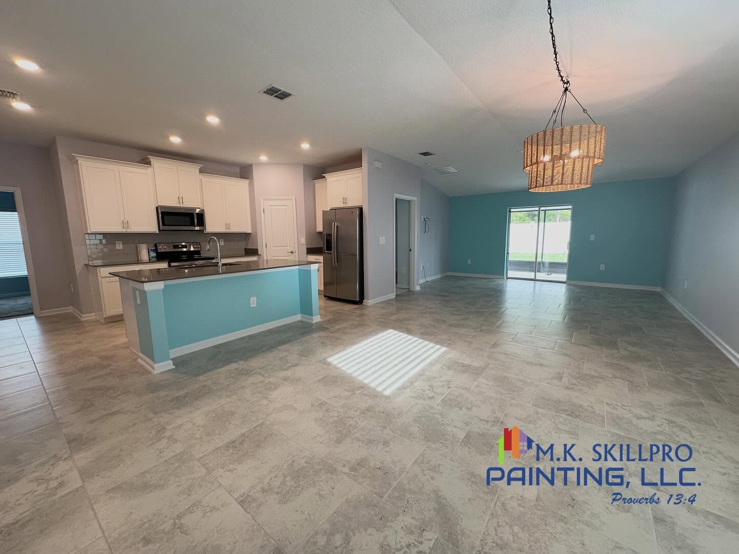 Painted interior with teal feature wall and open plan living