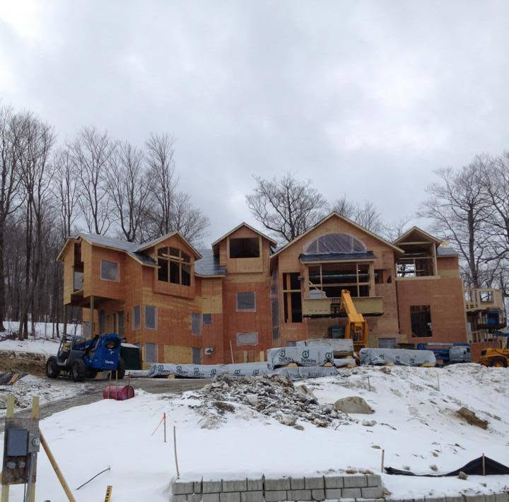 Large multi-storey residential development under construction in winter