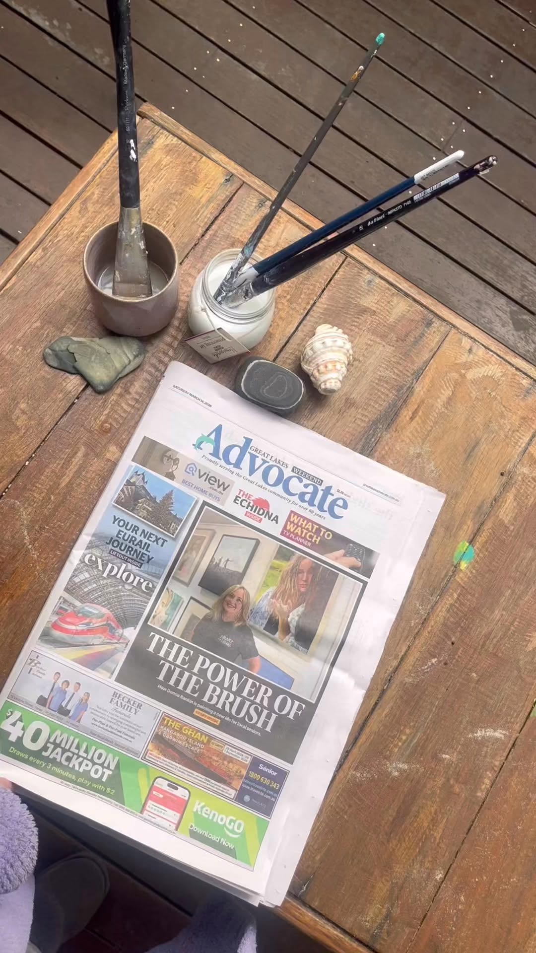 Great Lakes Advocate newspaper open to the article "The Power of the Brush"