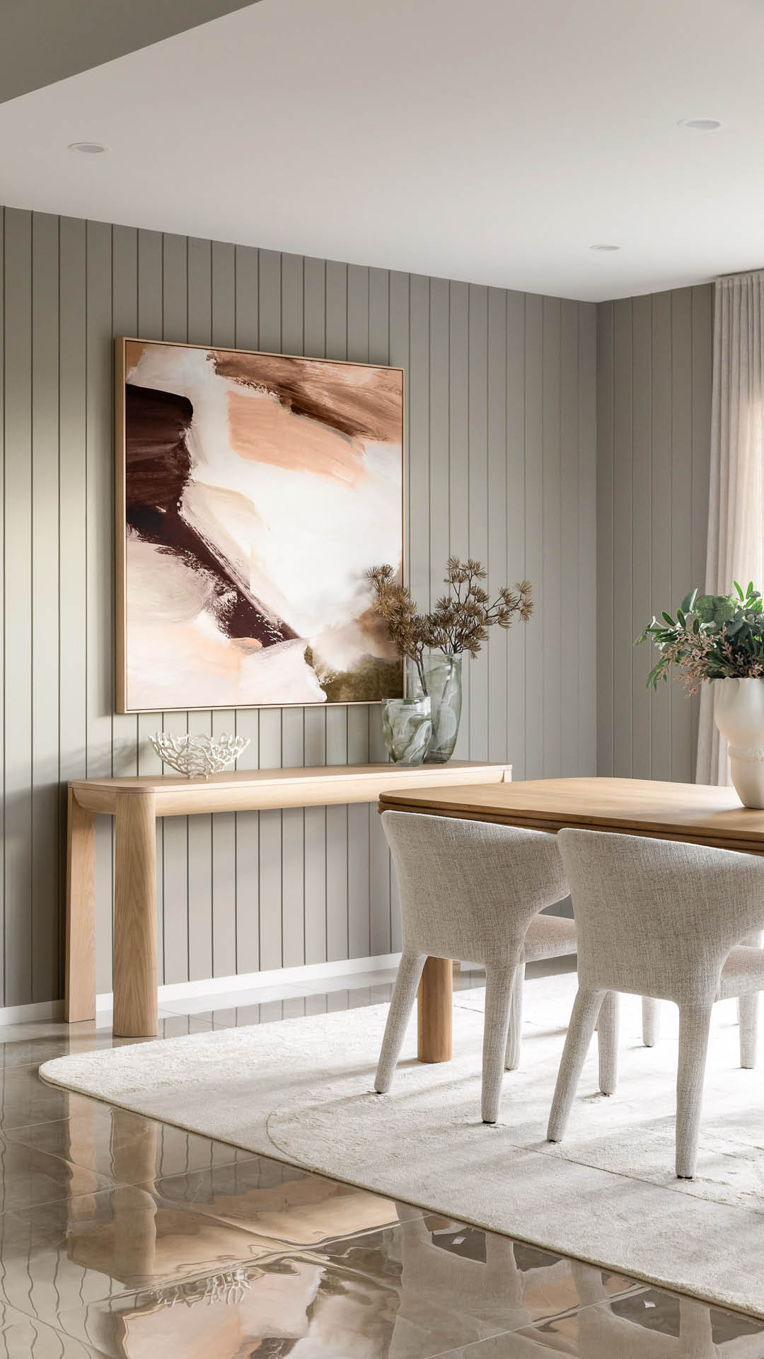 Open-plan kitchen and dining area with island bench in a Carlisle display home