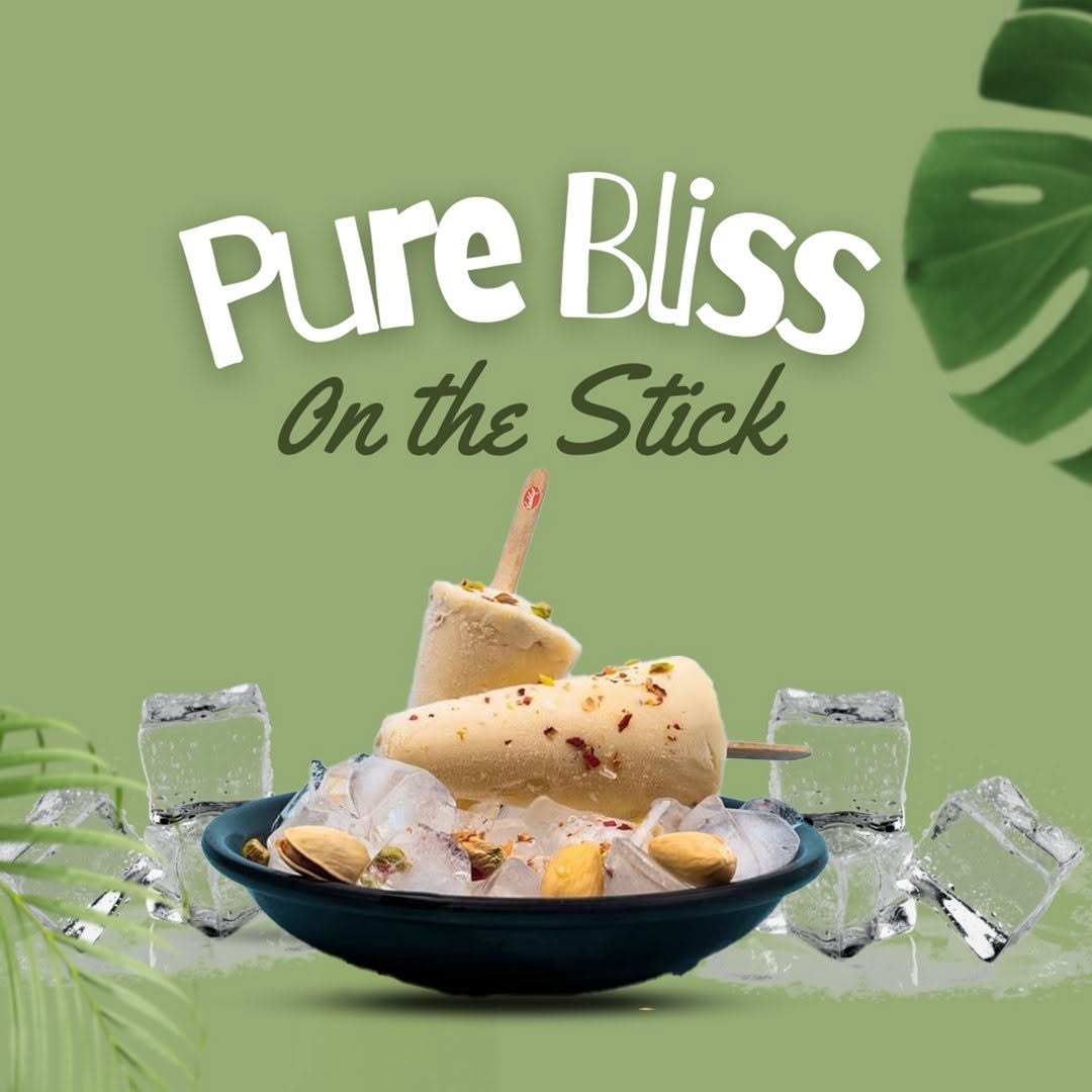 Indian-style kulfi on a stick served on a bed of ice with pistachios