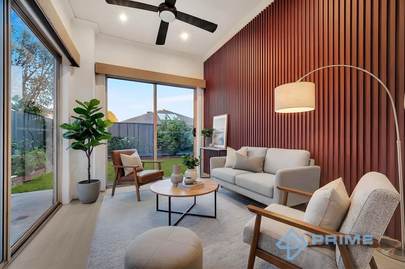 Stylish living room with timber slat feature wall and sliding doors to garden