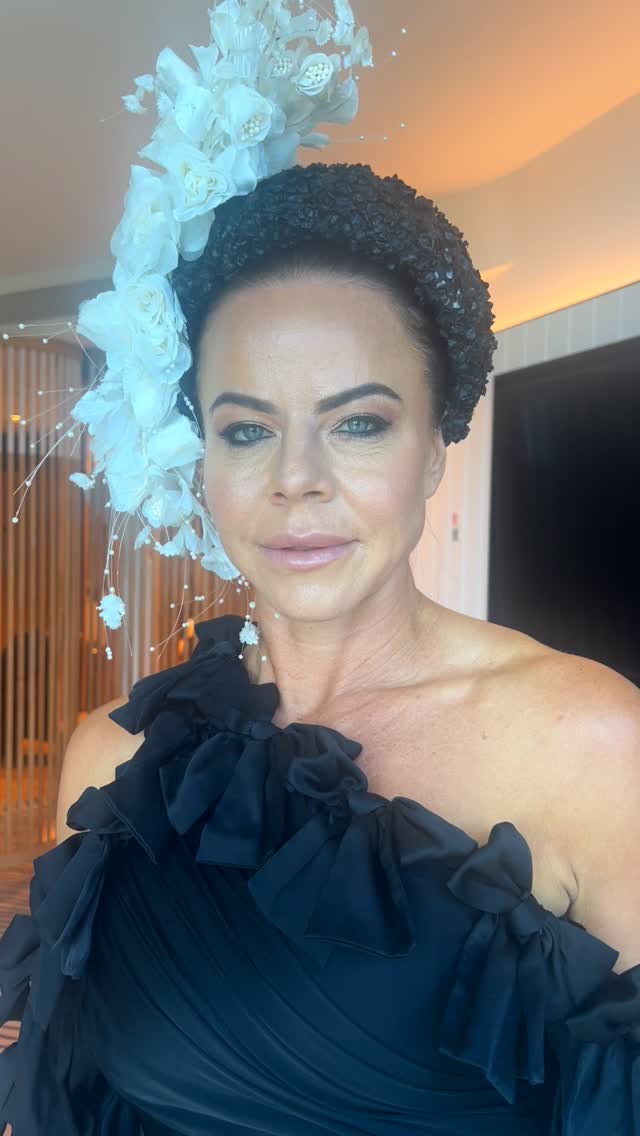 Client with soft romantic updo and glowing skin by MVC Hair and Makeup
