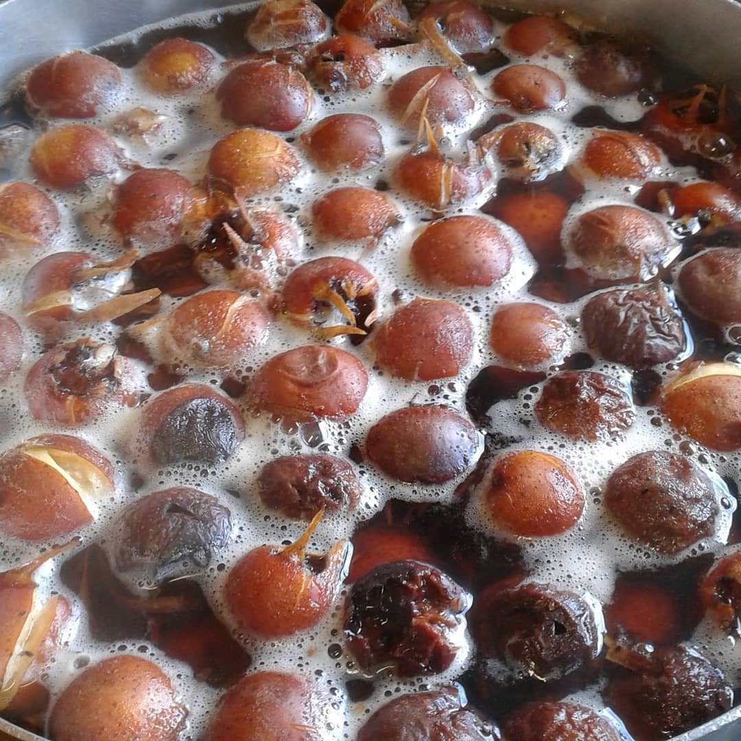 Pot of stewed fruit (plums) bubbling away — used in homemade preserves and cakes at Bruthen Tearooms