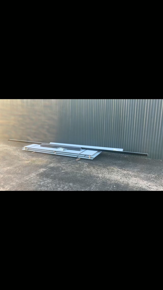 Custom metal roof flashing pieces laid out ready for installation
