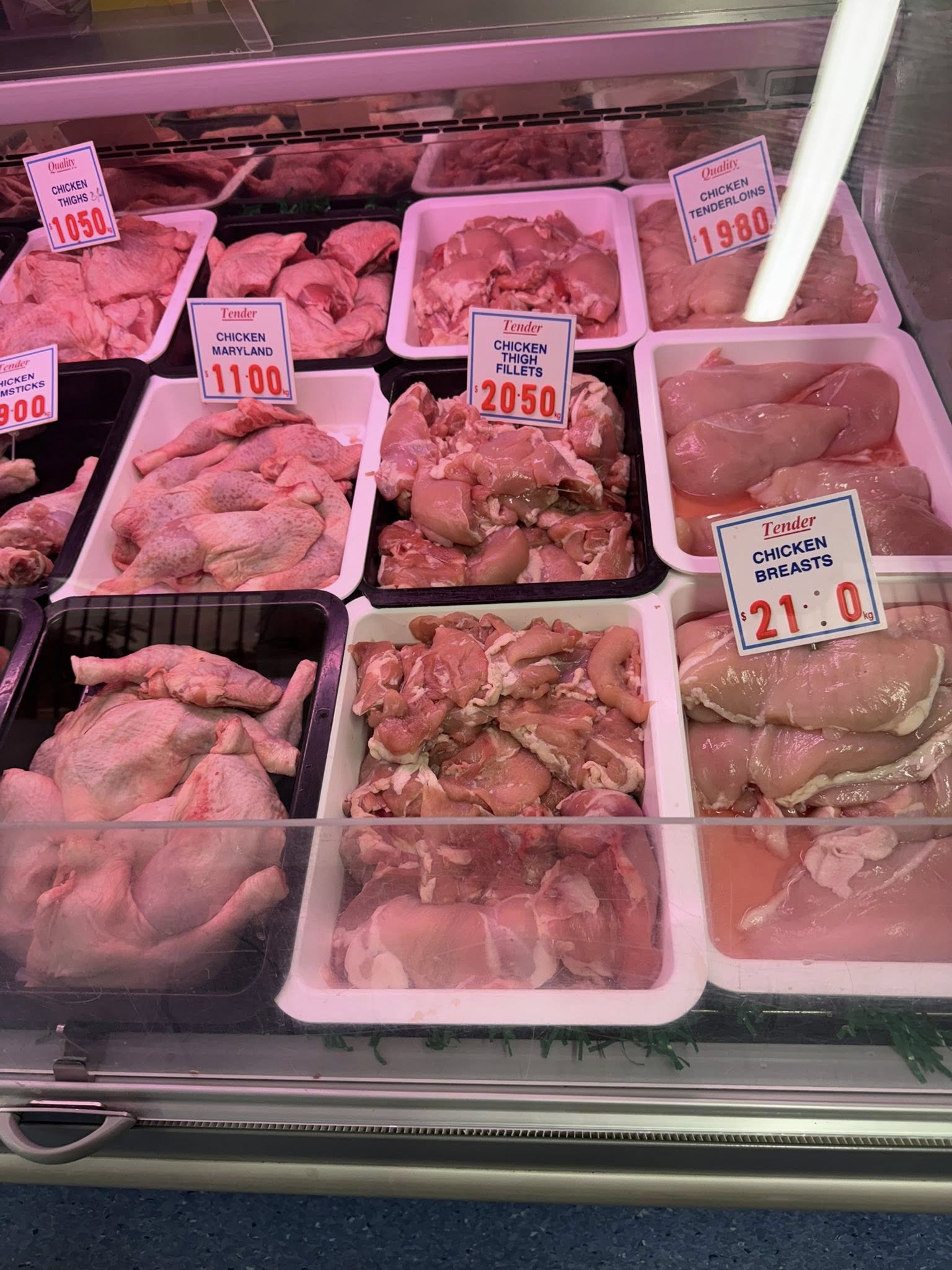 Chicken maryland, thigh fillets and chicken breasts freshly displayed