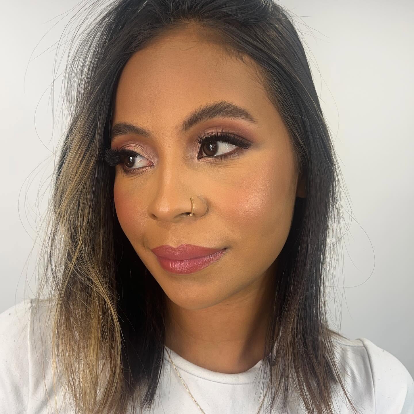 Glowing soft-glam makeup look with defined brows and blush