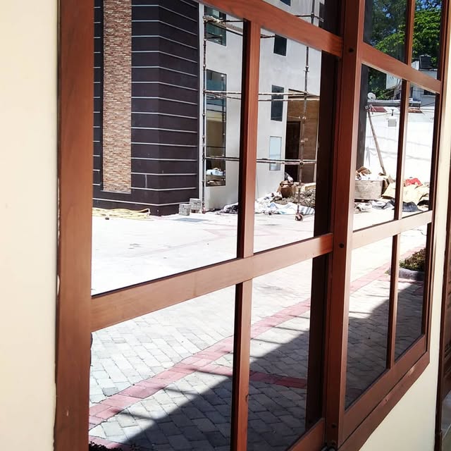 Aluminium-framed grid glass windows installed on a building