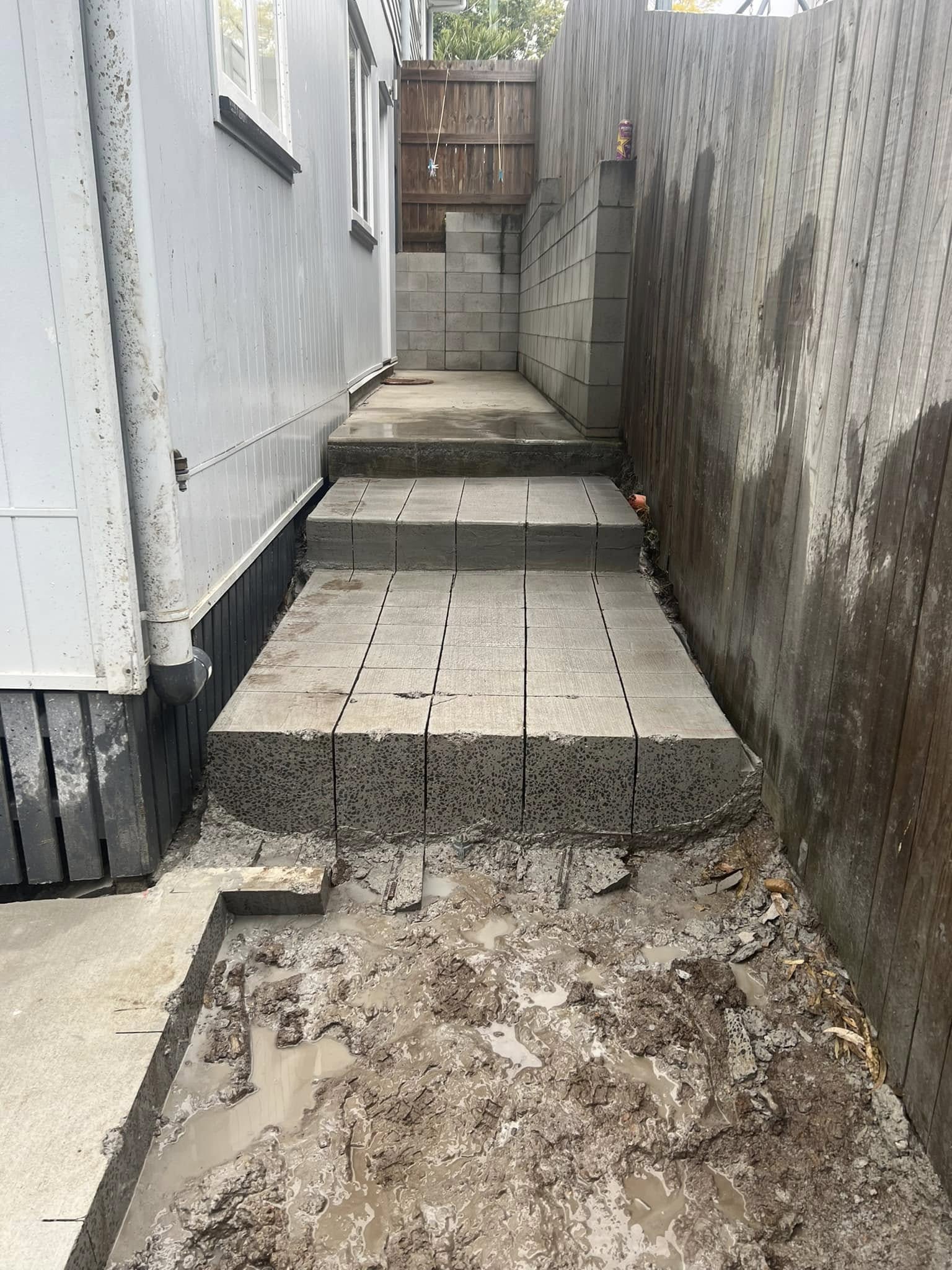 Newly laid concrete masonry steps and paving blocks during construction — Brisbane Cutting & Engineering project