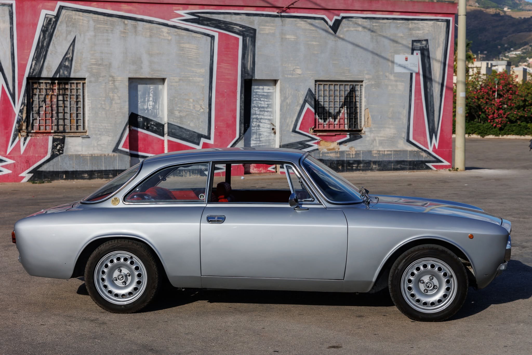 Silver Alfa Romeo GT side profile — classic car for sale