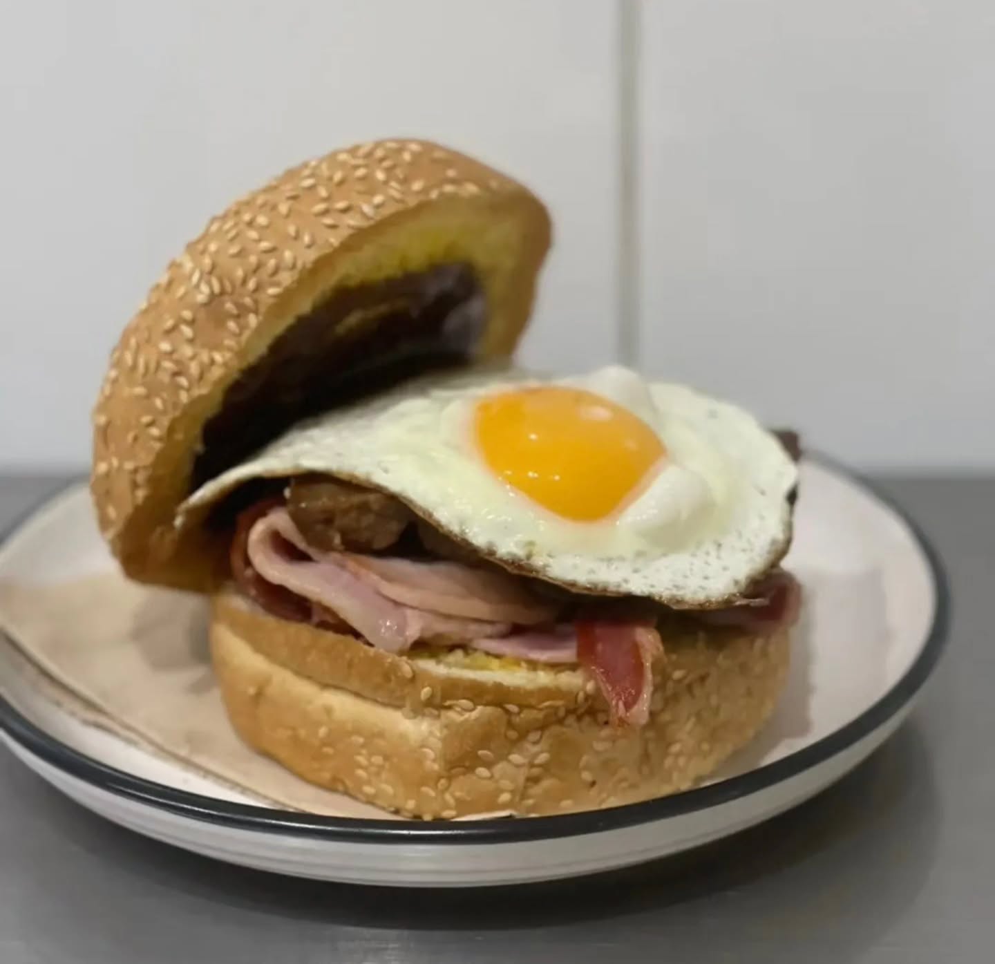 A fresh bacon and egg roll with a takeaway coffee at The Northshore Cafe