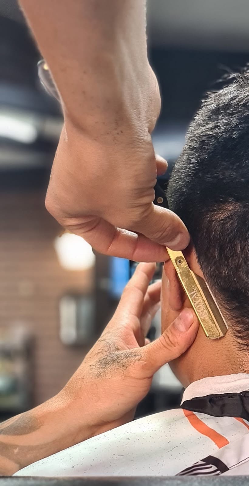 Straight razor beard grooming service at MH Barbers Studio