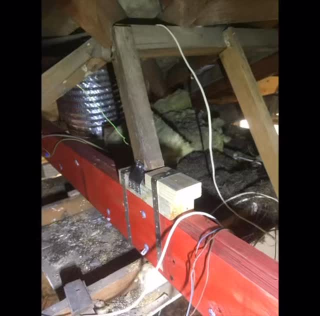 Roof space wiring and insulation work during construction