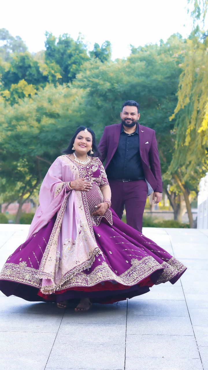 Bride in a stunning purple lehenga showcasing Aditi's bridal makeup work