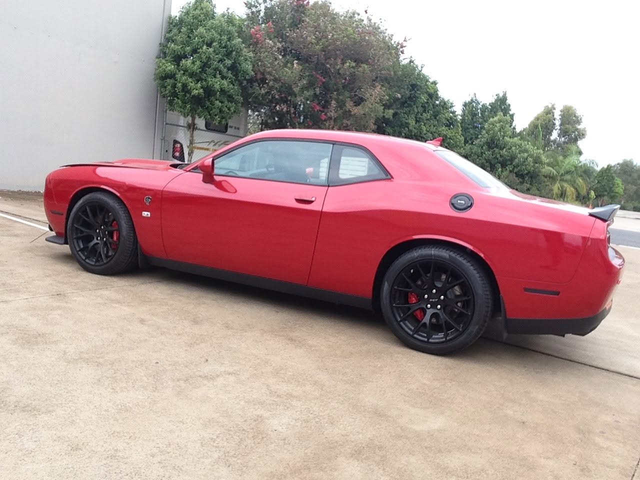 Custom black interior of a Dodge Challenger SRT with sport steering wheel