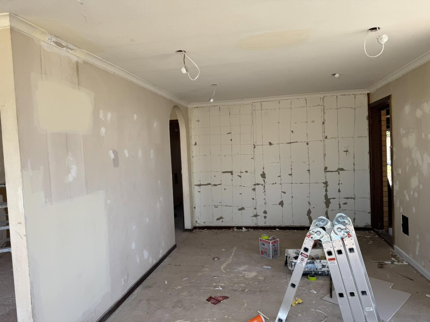 Interior room showing plaster patch repair work in progress