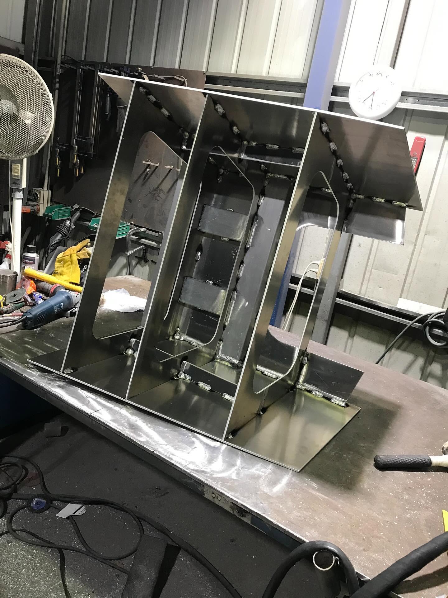 Custom stainless steel brackets and frames fabricated in the LJP Industries workshop