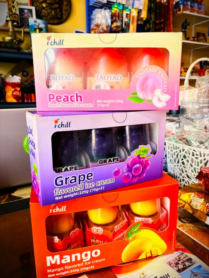 Boxes of i.chill peach, grape and mango flavoured ice cream stacked at Nepalese Indo Bazaar