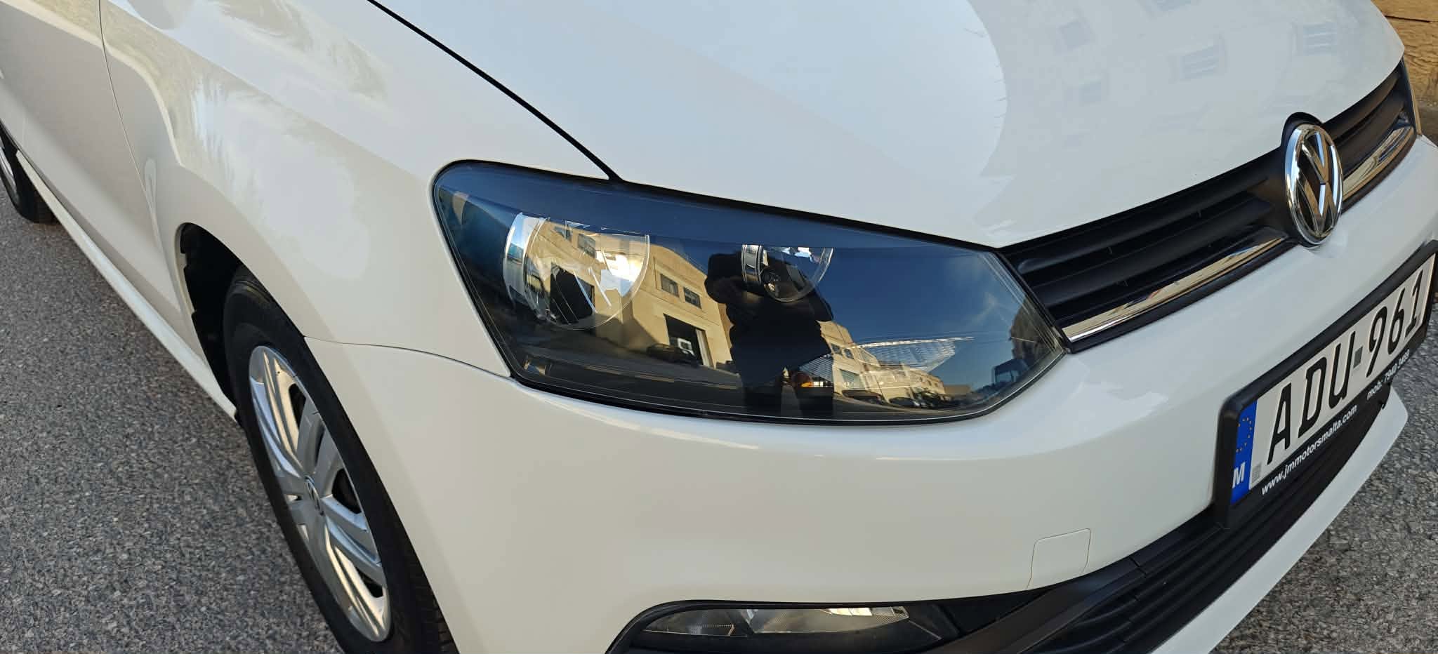 VW headlight close-up showcasing quality pre-owned vehicles