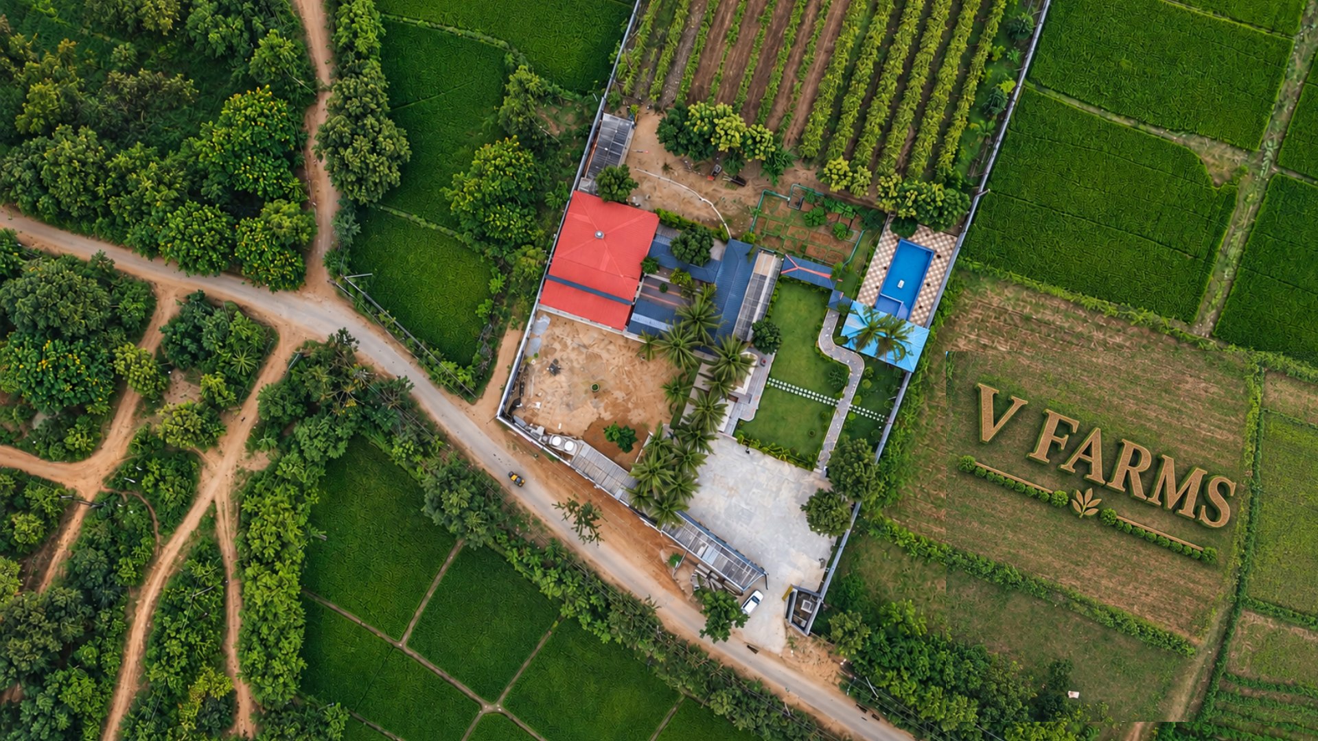 Aerial view of V-Farms surrounded by green fields