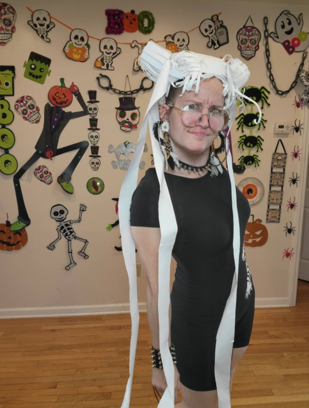 Donna Marie Milligan wearing a white toilet paper wig sculpted into an avant-garde Halloween updo.