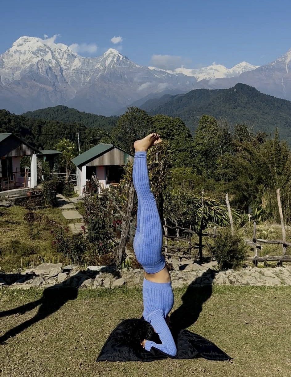 Priyanka yoga pose with Himalayan mountains