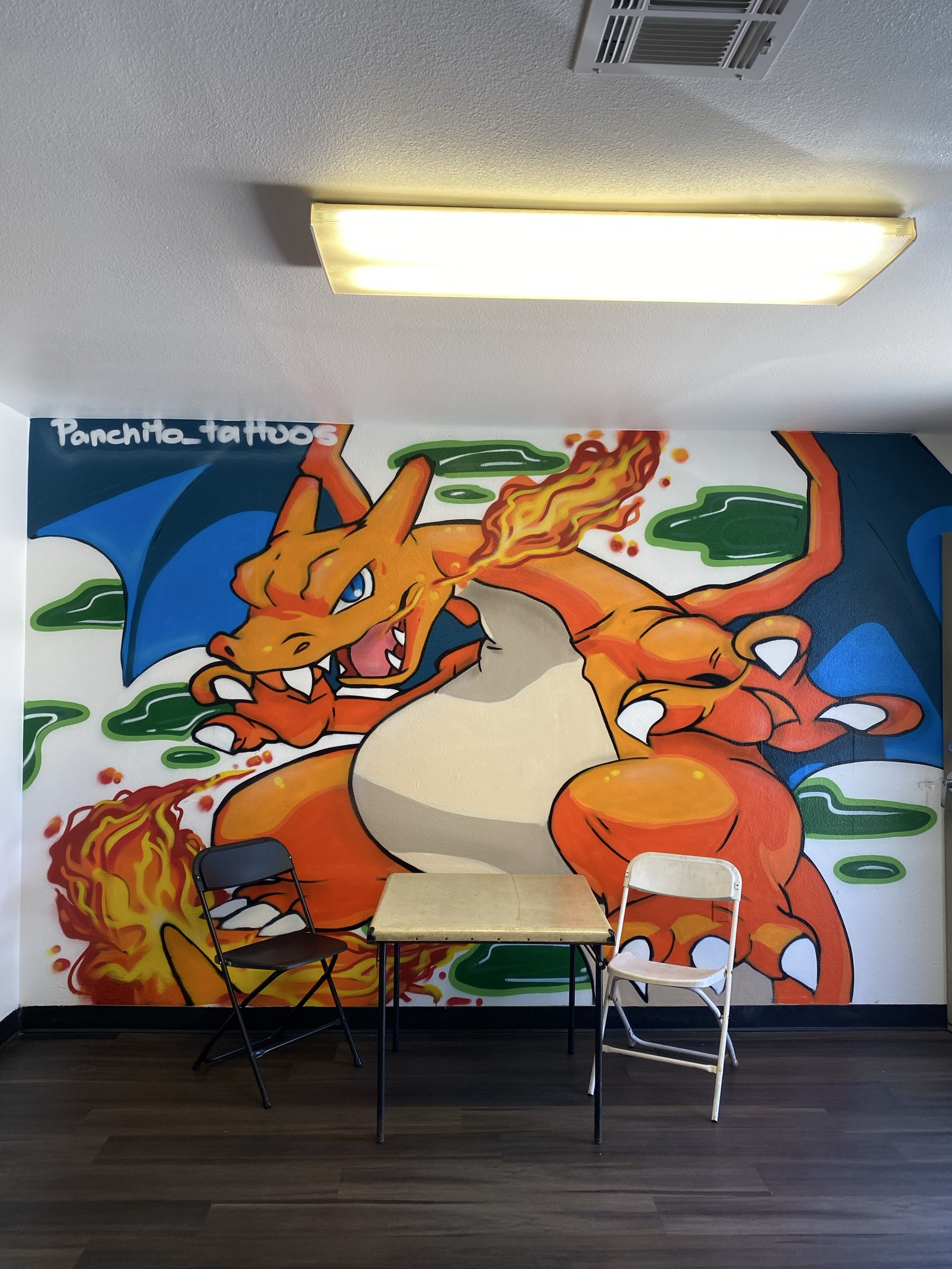 Gaming Tournament Space with Charizard Mural