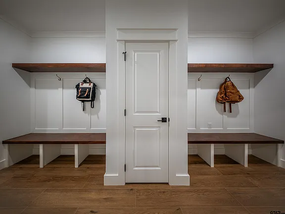 Mudroom with walnut shelves and built-in bench