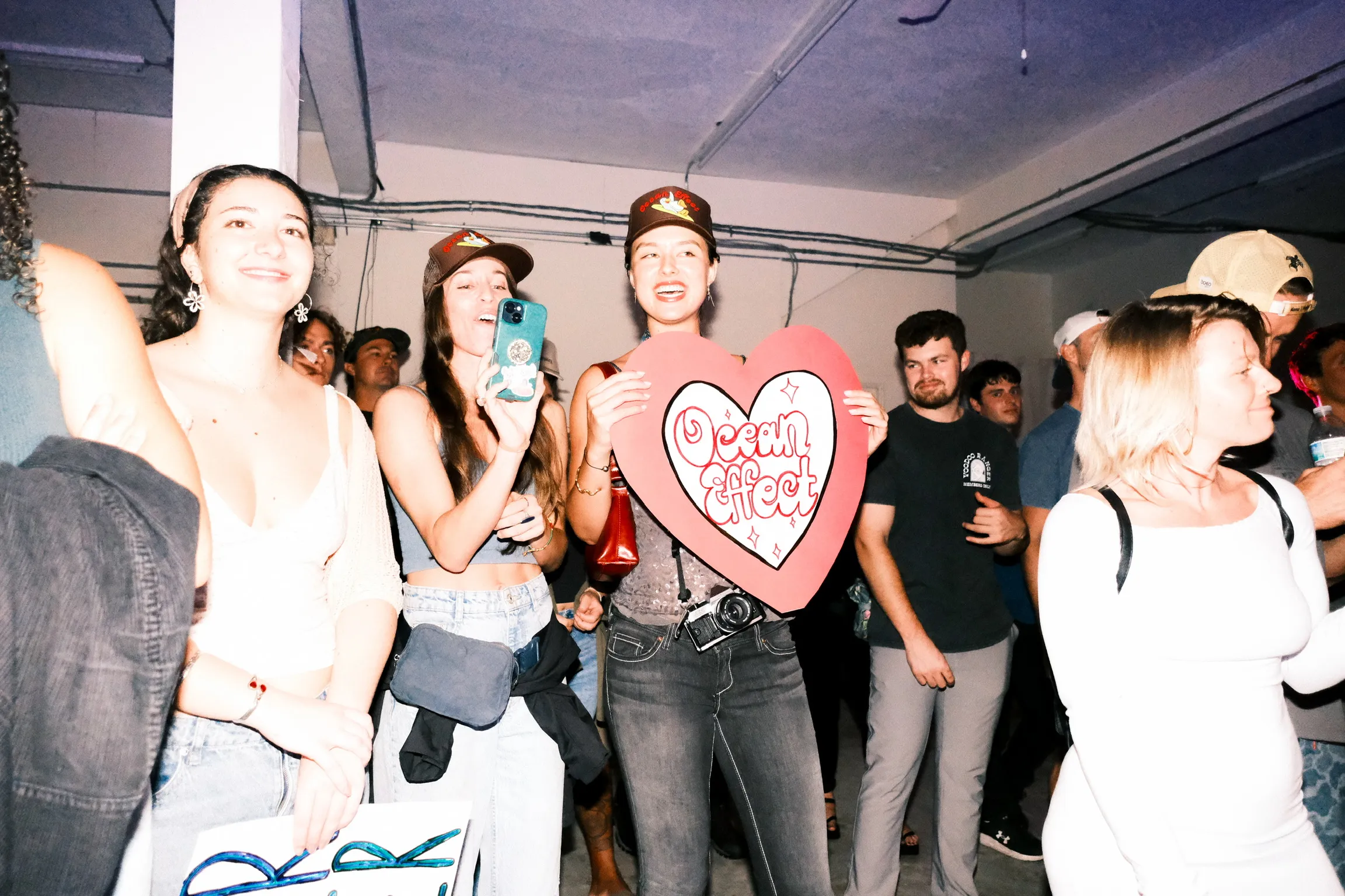 Fans at Ocean Effect show with heart sign