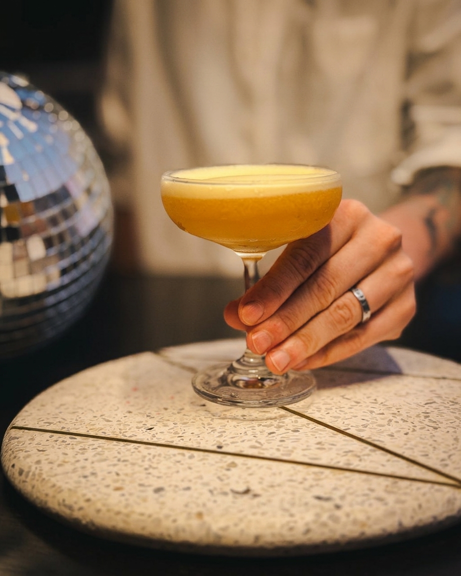 Craft cocktail being served