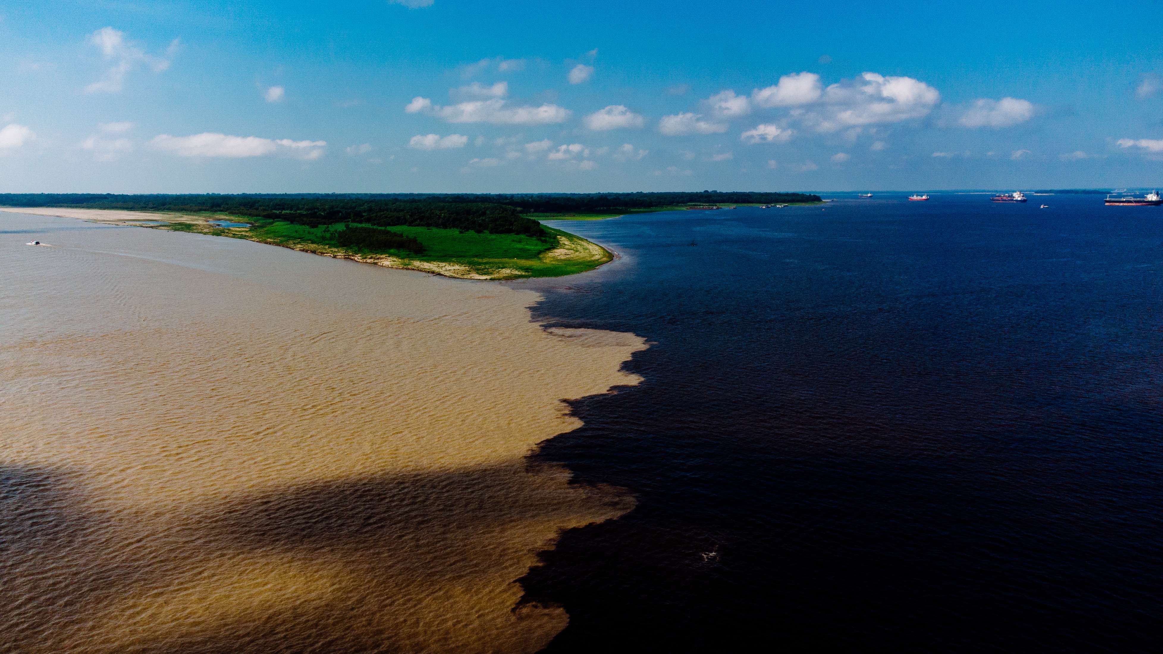 Aerial view of the meeting of the waters of the Rio Negro in Manaus, Amazon