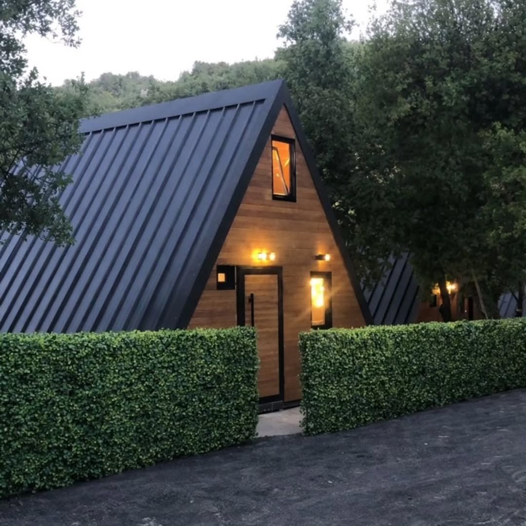 A-frame cabin exterior at dusk