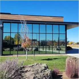 Modern commercial building with large floor-to-ceiling tinted windows