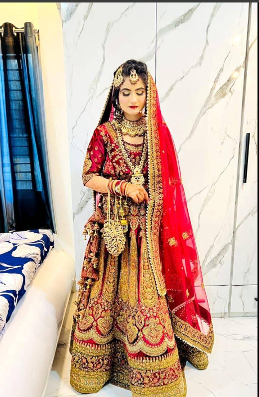 Bride in red-and-gold embroidered lehenga at Kaizen