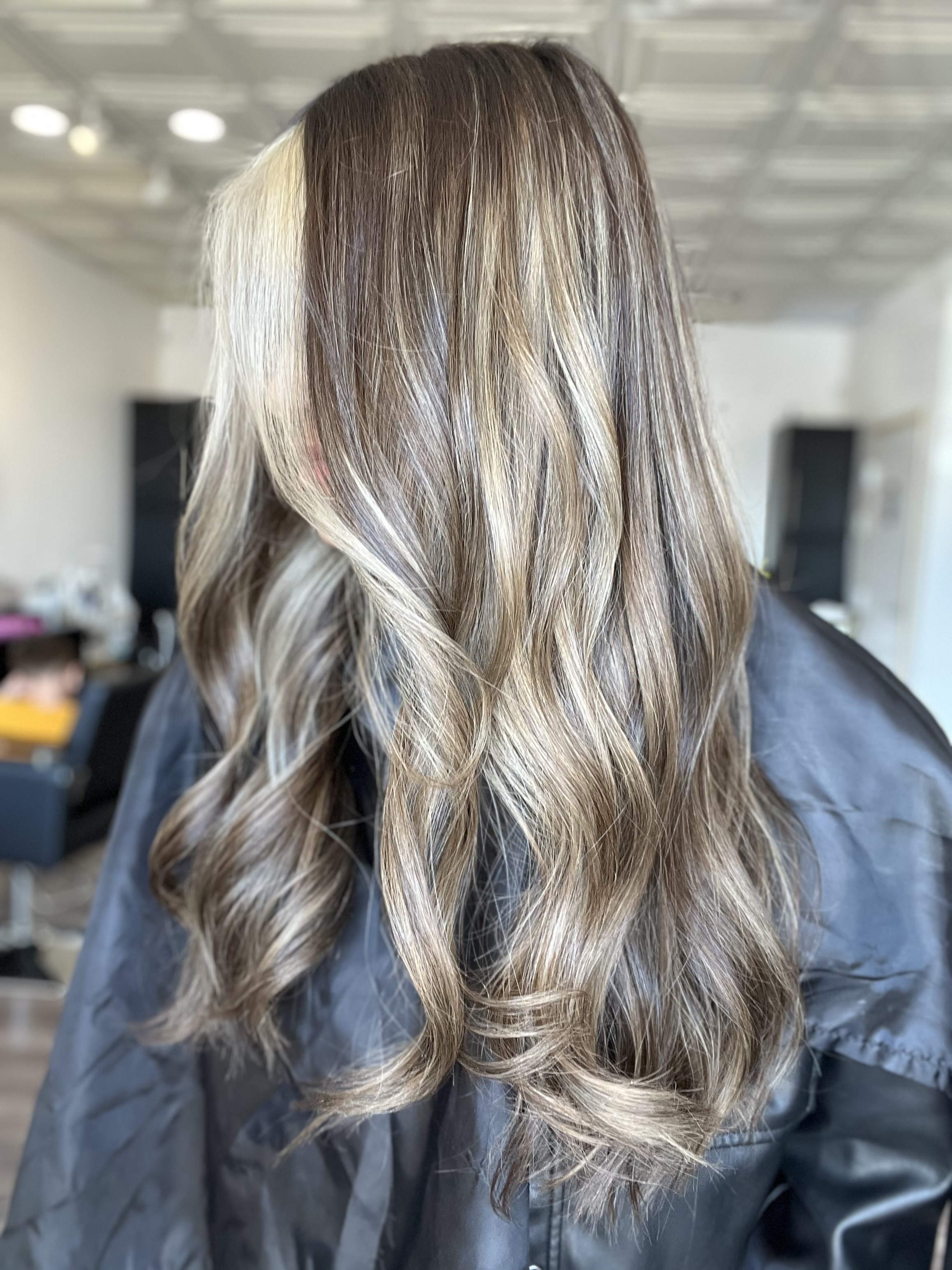 Brunette color correction with caramel highlights at The Hair Co. Salon in Phoenix, AZ