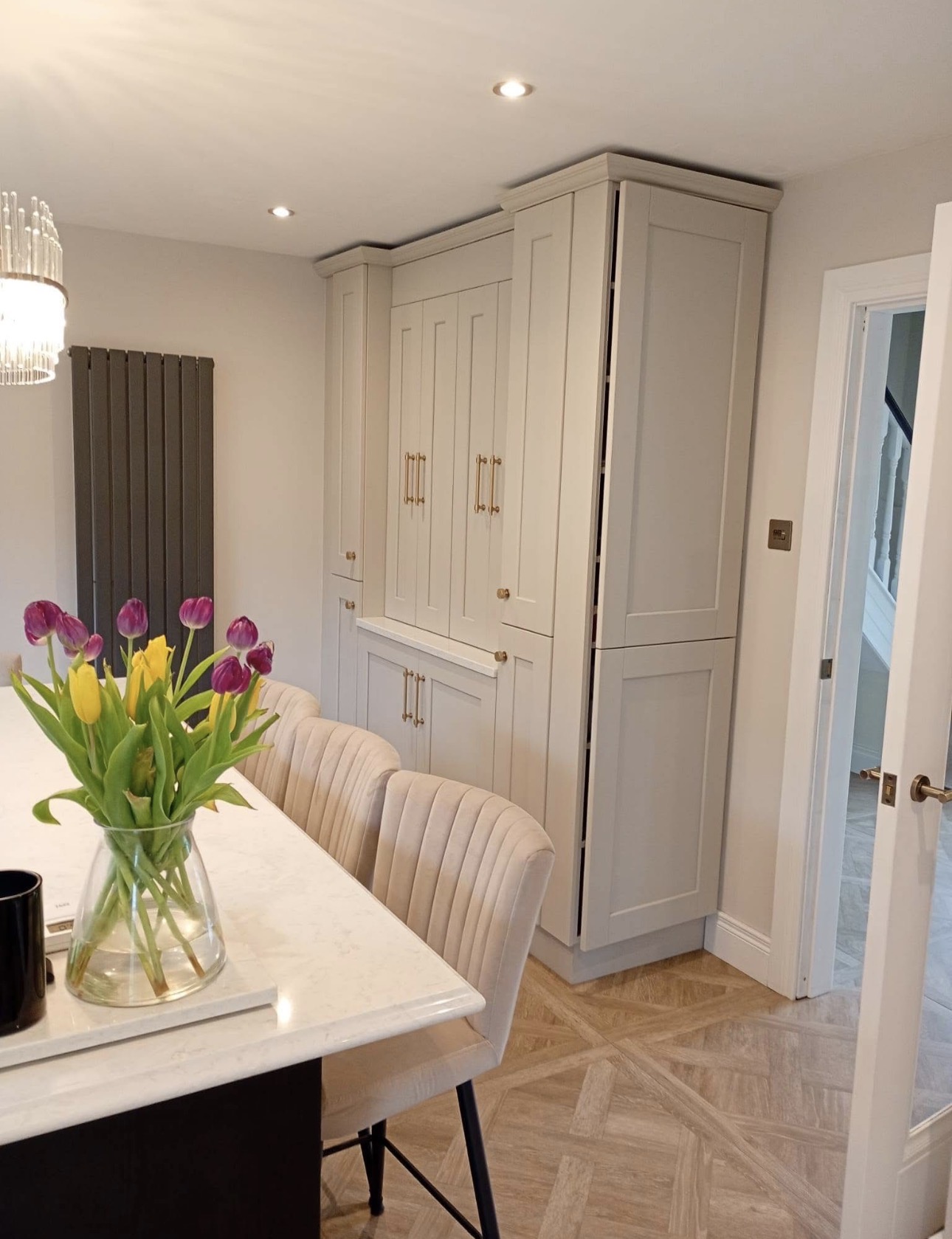 Custom built-in storage cabinetry with brass hardware - bespoke joinery in Ireland