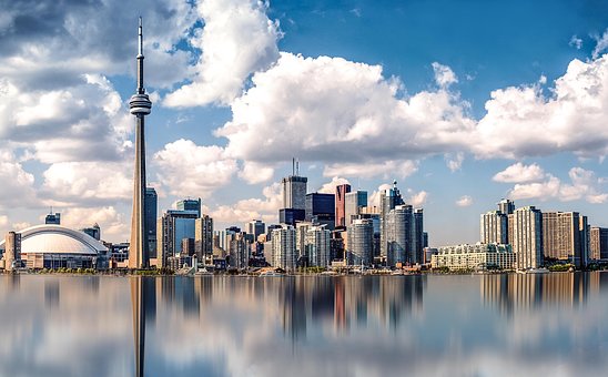 Toronto skyline with CN Tower reflecting on Lake Ontario