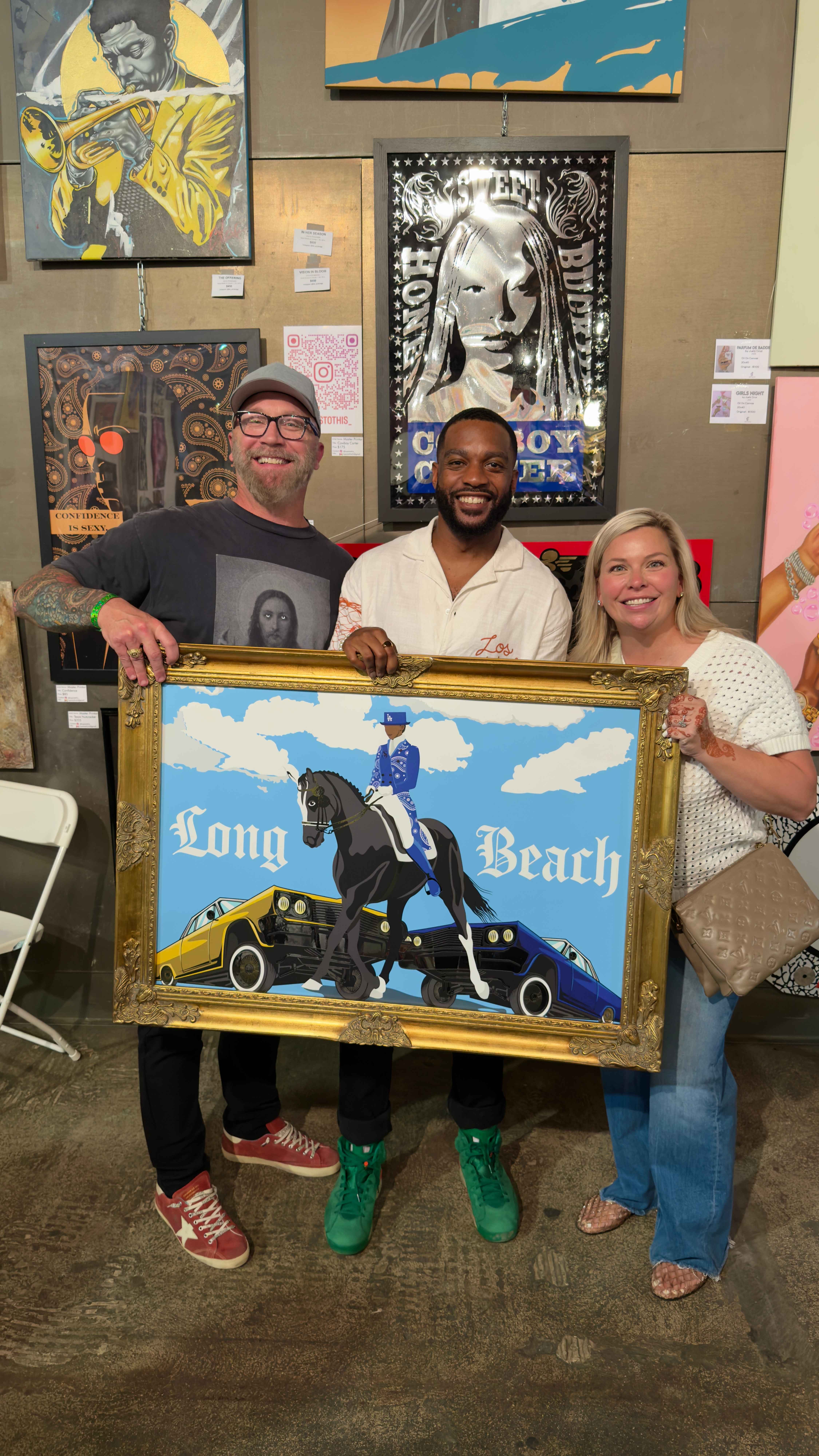 Guests holding a framed piece at the LA Chocolate and Art Show