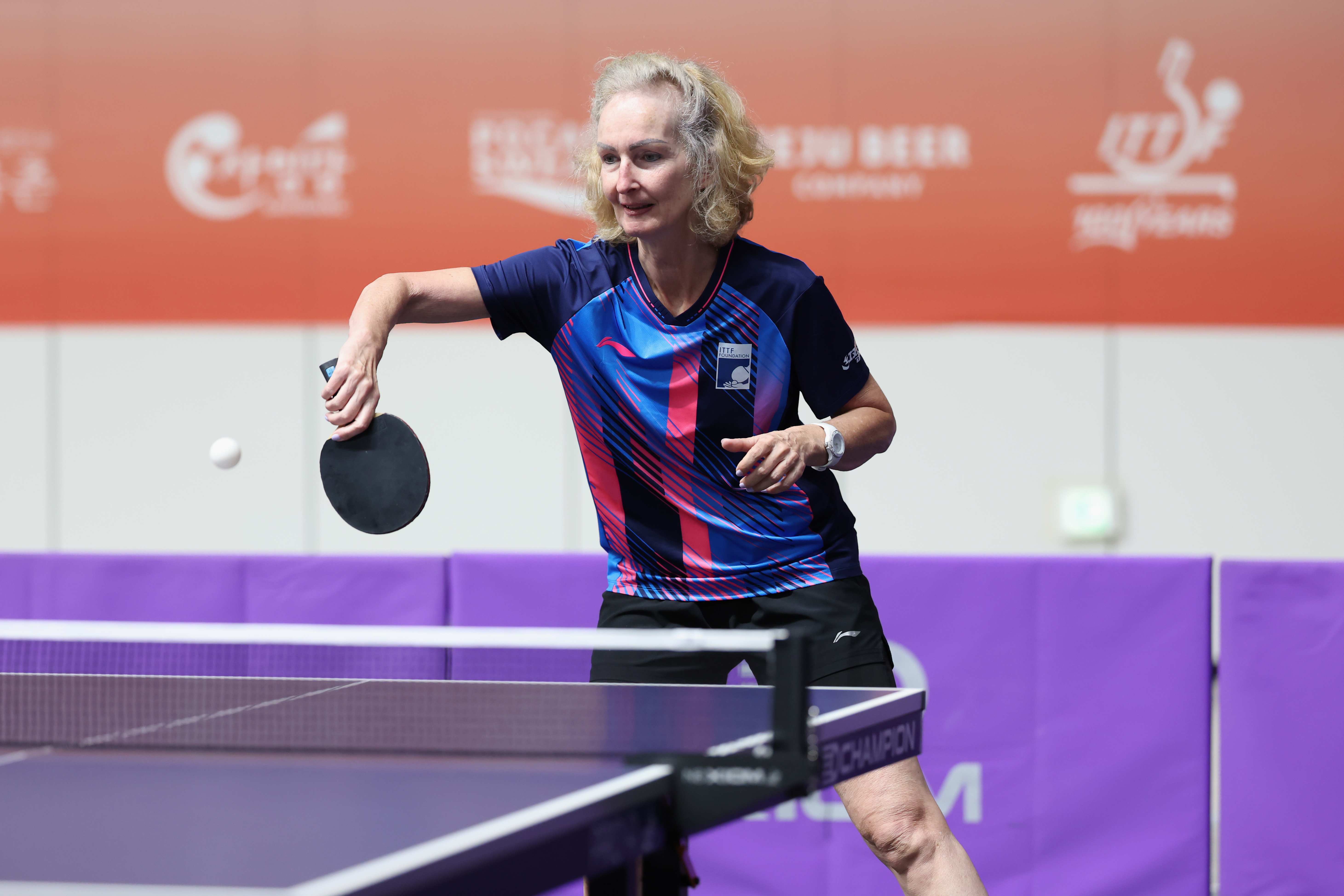Christine Knapp mid-rally at the ITTF World Masters in Gangneung, focused and in full stride