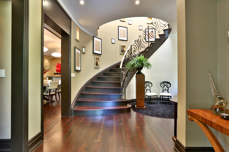 Elegant foyer with curved staircase