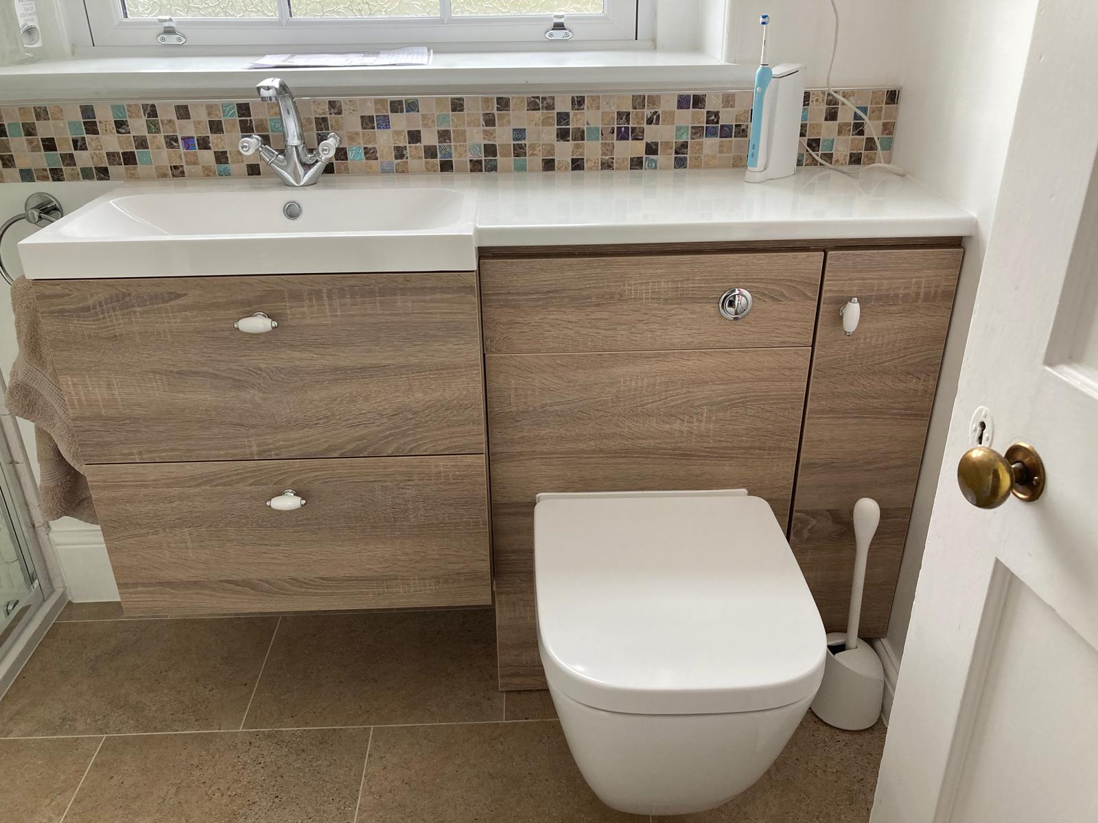 Vanity unit with mosaic tile splashback