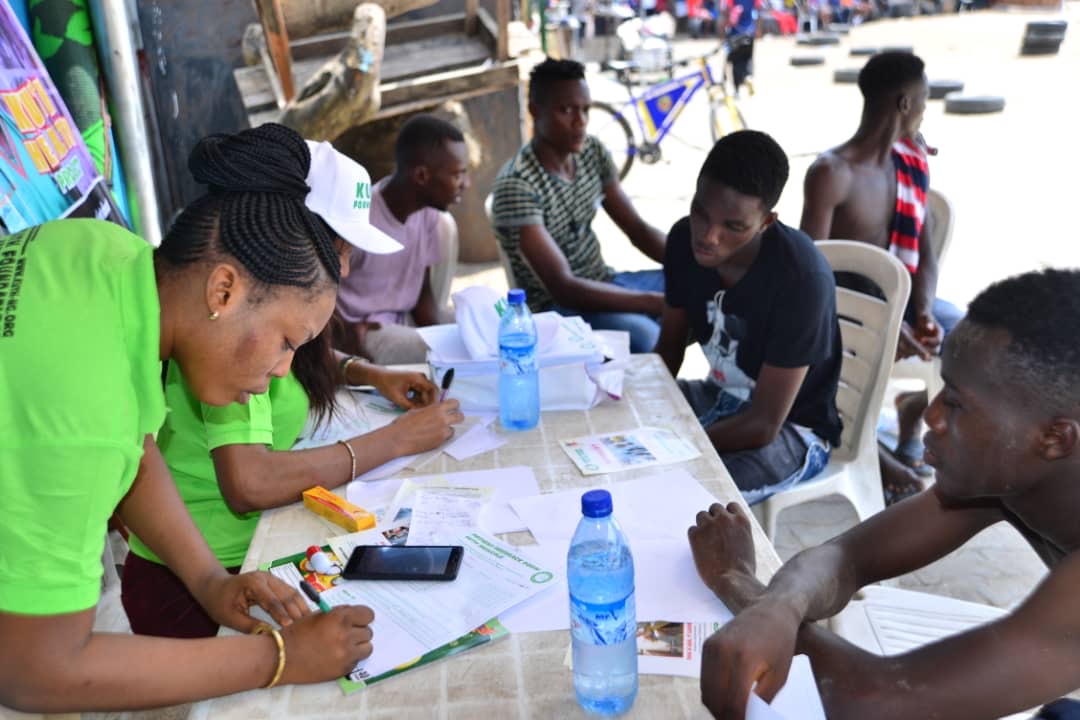 Registration table with young community members