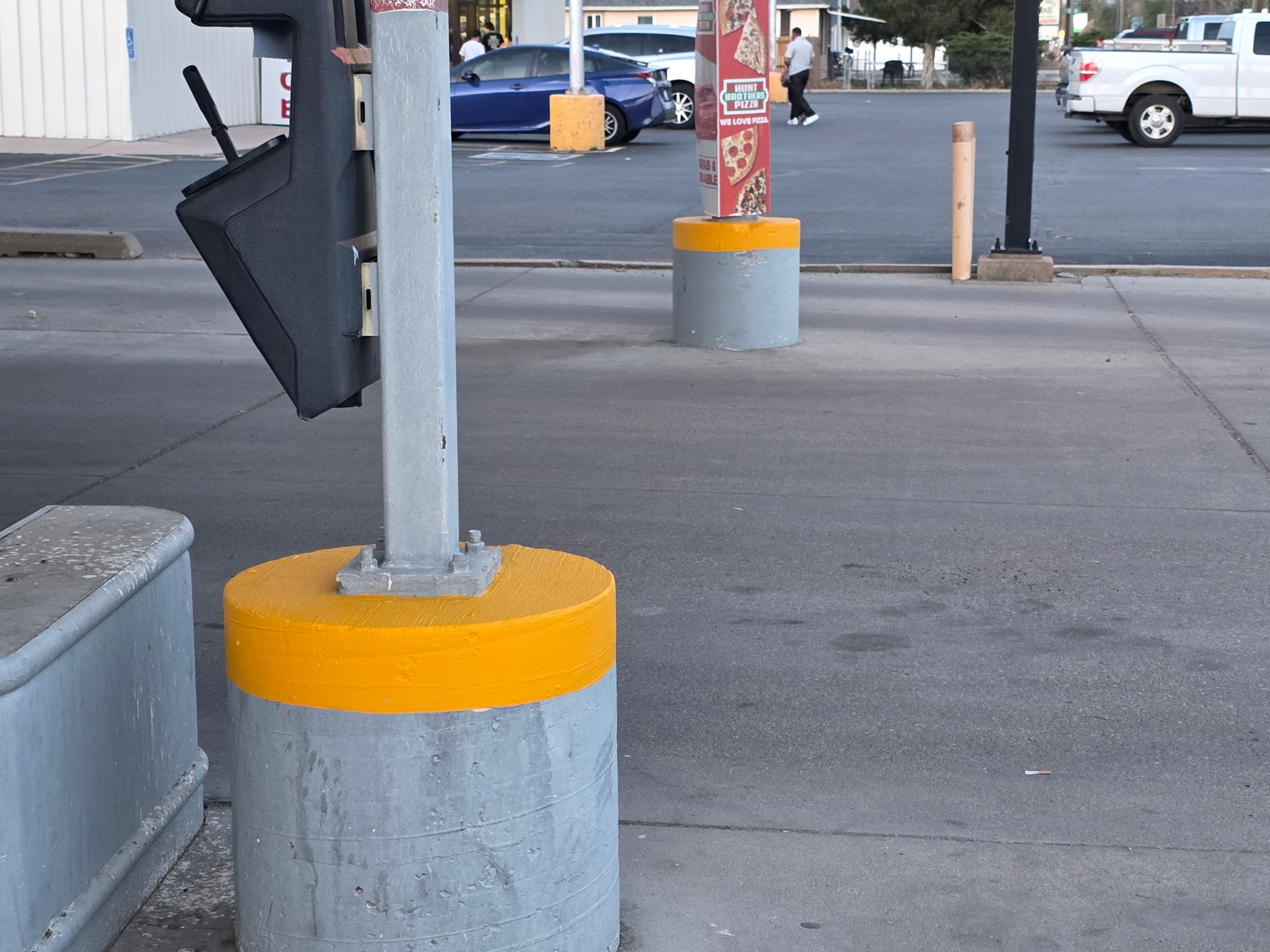 Freshly painted yellow bollards