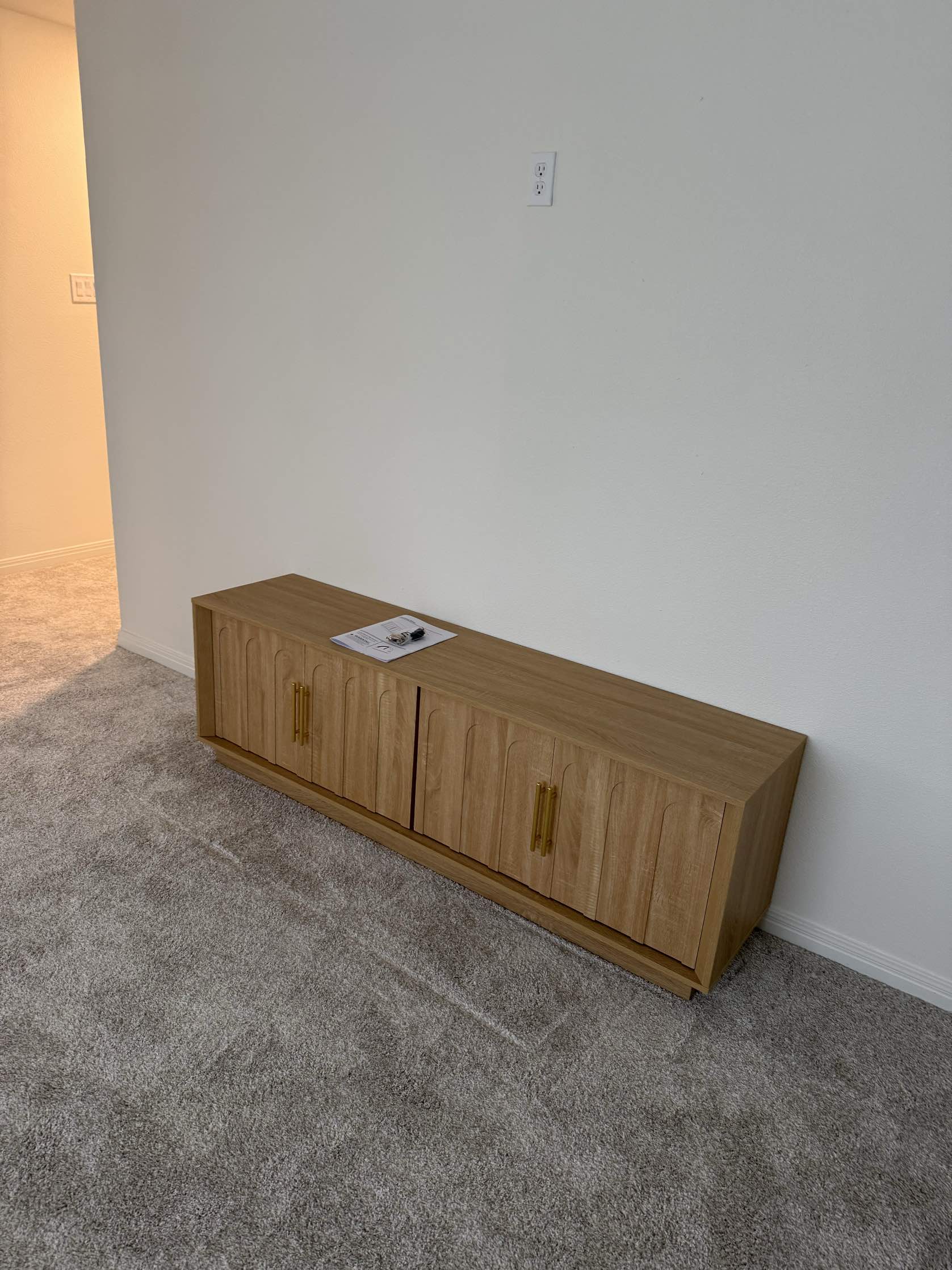 Assembled wooden media console with gold handles