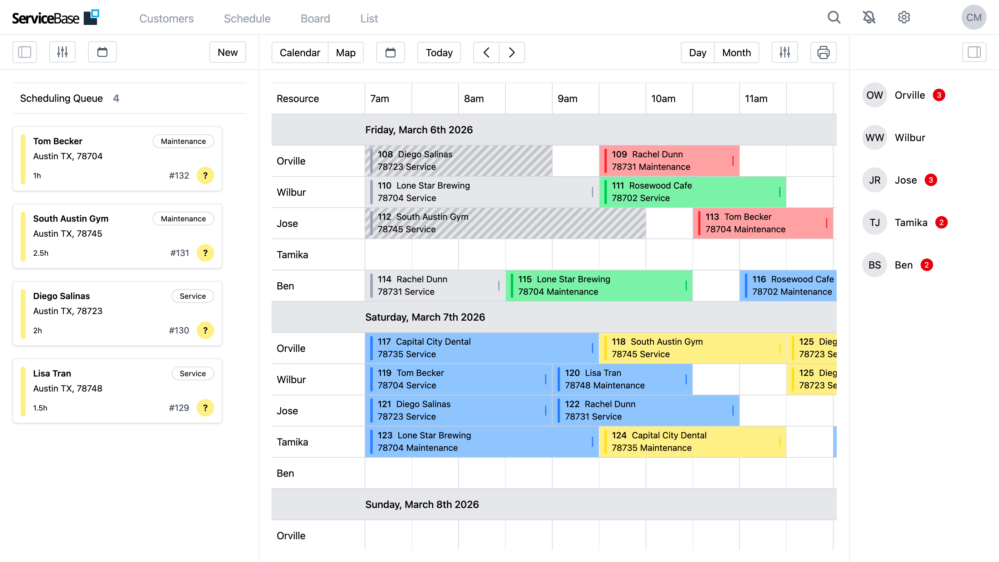 ServiceBase schedule board — technicians scheduled across the day, with a scheduling queue of unassigned jobs