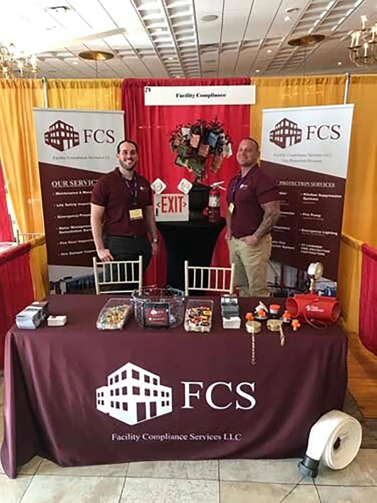 FCS trade show booth with staff and equipment display