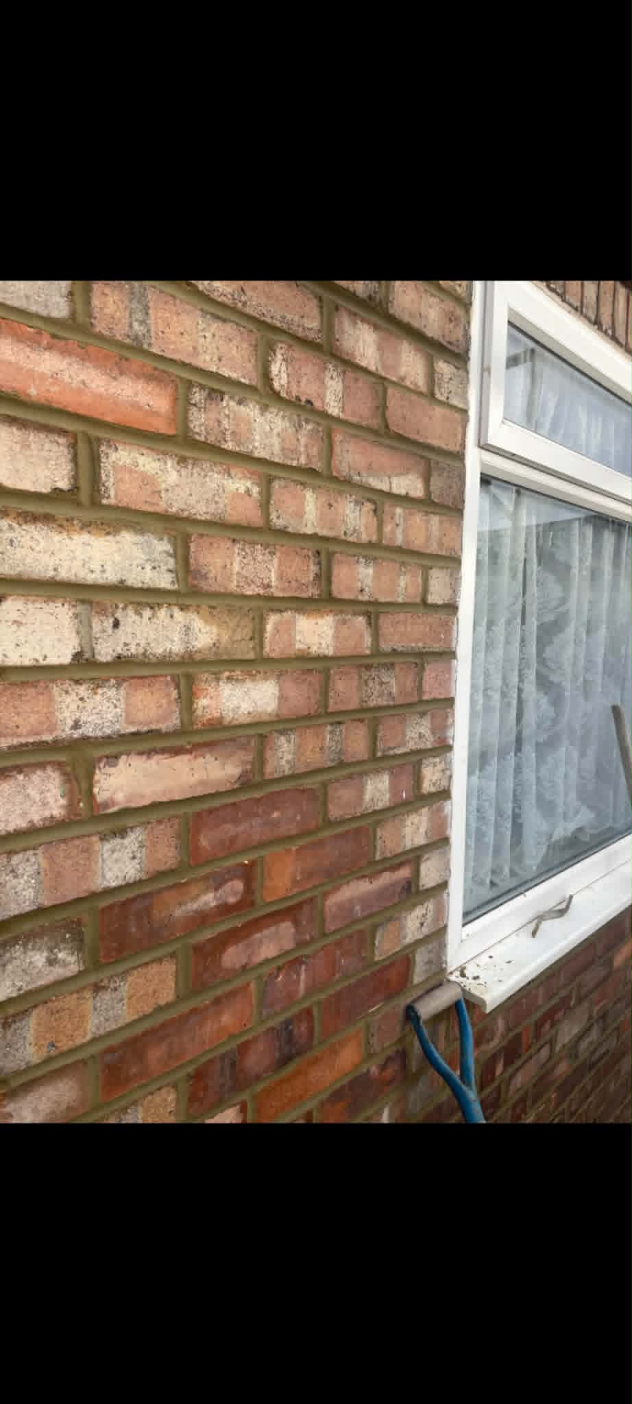 Close-up of freshly repointed brickwork showing clean mortar joints