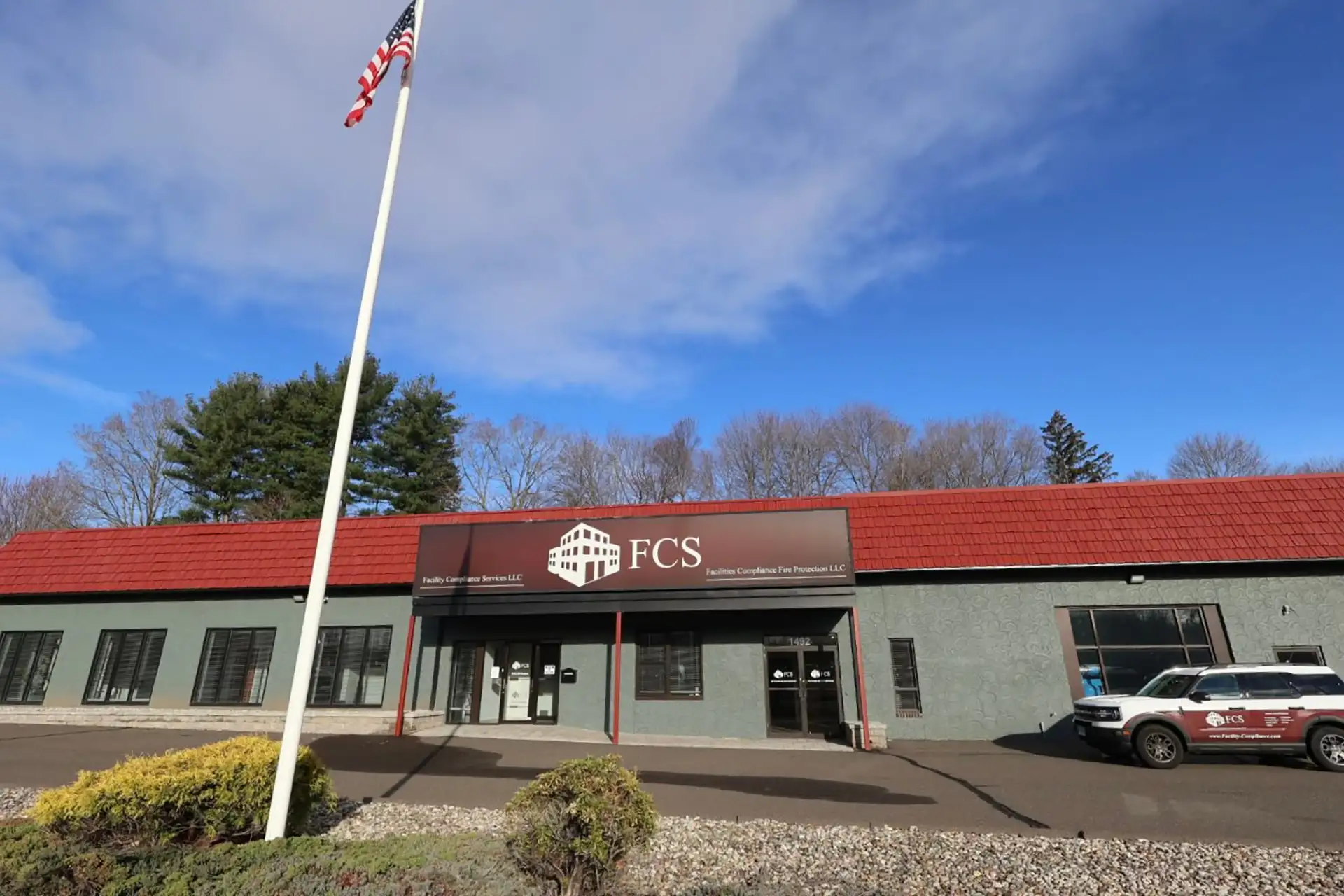 FCS office building exterior with American flag